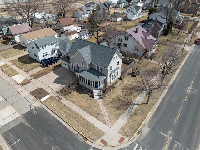 birds eye view of property with a residential view