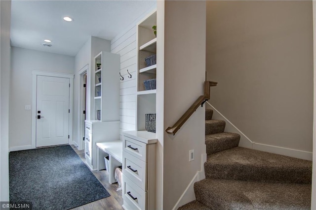 mudroom with wood finished floors, baseboards, carpet, and recessed lighting
