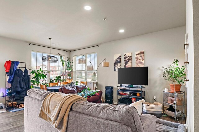 living area with wood finished floors and recessed lighting