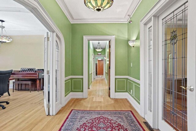 3316 W Wisconsin Ave, Milwaukee, WI 53208 - foyer with ornamental molding, french doors, wainscoting, a decorative wall, and wood finished floors