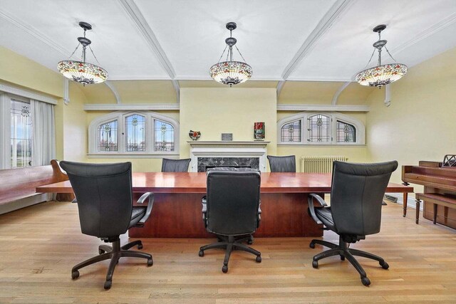 3316 W Wisconsin Ave, Milwaukee, WI 53208 - office featuring radiator, wood finished floors, a fireplace, and ornamental molding