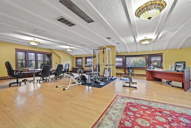 3316 W Wisconsin Ave, Milwaukee, WI 53208 - exercise room featuring visible vents, wood finished floors, and a textured ceiling