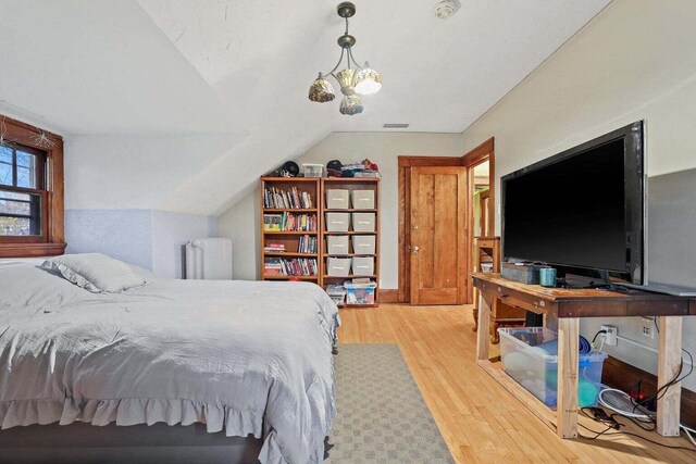 3316 W Wisconsin Ave, Milwaukee, WI 53208 - bedroom with light wood finished floors and lofted ceiling