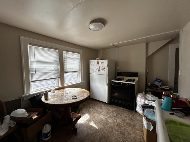 1842 Lasalle St, Racine, WI 53402 - kitchen featuring freestanding refrigerator and gas stove