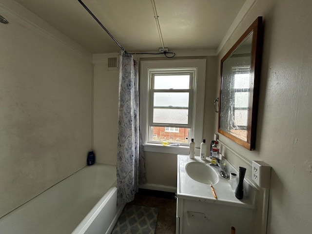1842 Lasalle St, Racine, WI 53402 - full bath with vanity, baseboards, visible vents, and shower / tub combo