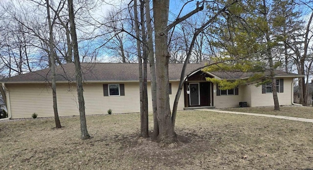 single story home with a shingled roof