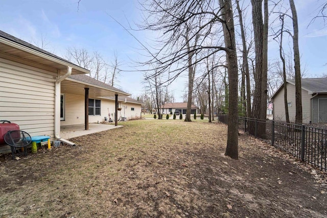 view of yard featuring a patio and fence