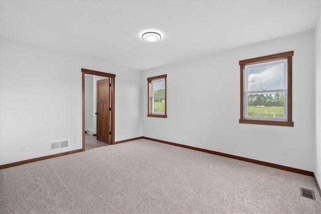 1705 107th St, New Richmond, WI 54017 - empty room with carpet floors and baseboards