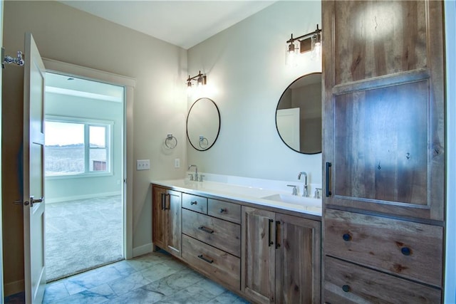 E5215 Queens Dr, Eleva, WI 54738 - bathroom with double vanity, baseboards, and marble finish flooring