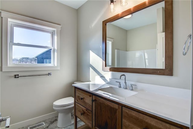 E5215 Queens Dr, Eleva, WI 54738 - bathroom featuring vanity, baseboards, toilet, and marble finish flooring