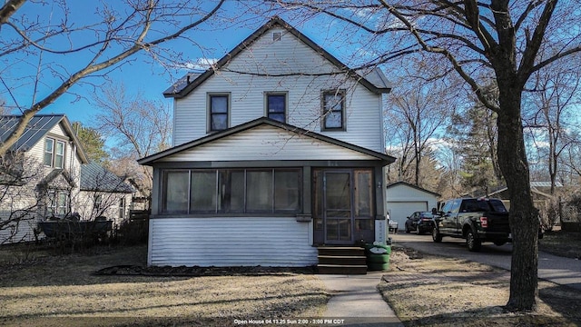 816 Royalton St, Waupaca, WI 54981 - view of front of property with entry steps, an outdoor structure, a sunroom, and a garage