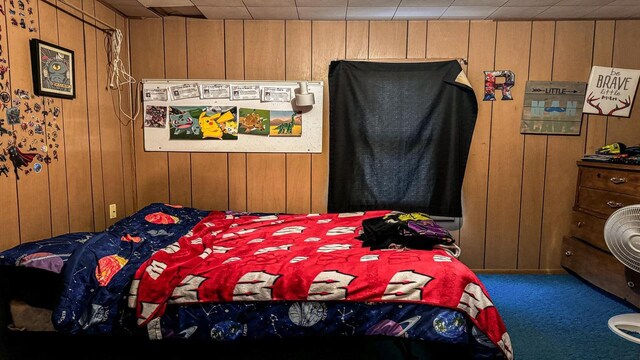 816 Royalton St, Waupaca, WI 54981 - carpeted bedroom featuring wood walls