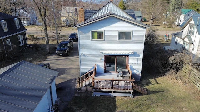 816 Royalton St, Waupaca, WI 54981 - rear view of house with a chimney