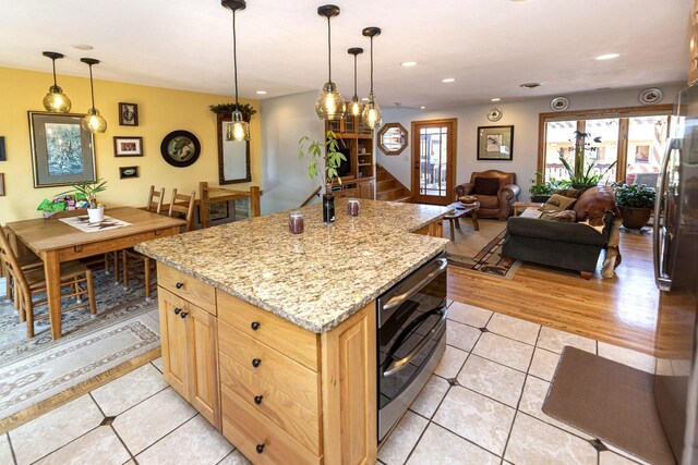 W340S2401 County Road C, Oconomowoc, WI 53066 - kitchen with recessed lighting, light tile patterned floors, freestanding refrigerator, pendant lighting, and light brown cabinetry