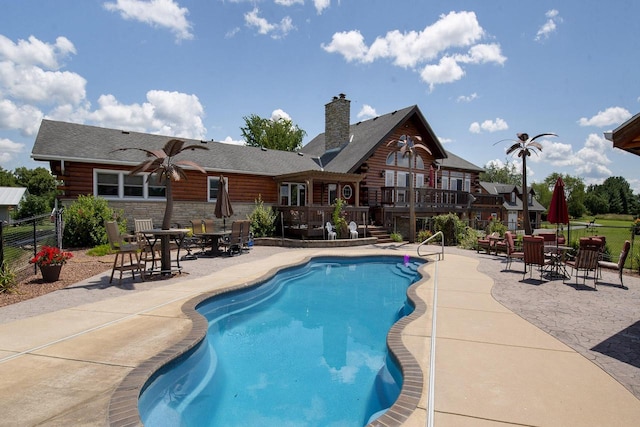 W340S2401 County Road C, Oconomowoc, WI 53066 - view of pool with a fenced in pool, a patio area, a deck, and fence