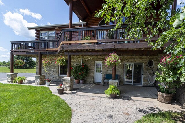 W340S2401 County Road C, Oconomowoc, WI 53066 - back of house with a patio, a yard, and stone siding