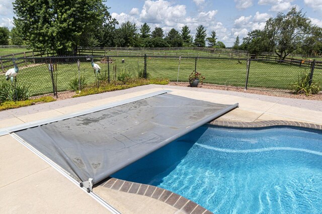 W340S2401 County Road C, Oconomowoc, WI 53066 - view of pool with a rural view, fence, and a lawn