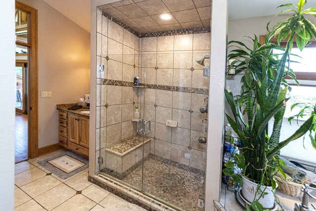 W340S2401 County Road C, Oconomowoc, WI 53066 - bathroom with tile patterned flooring, baseboards, a stall shower, and vanity