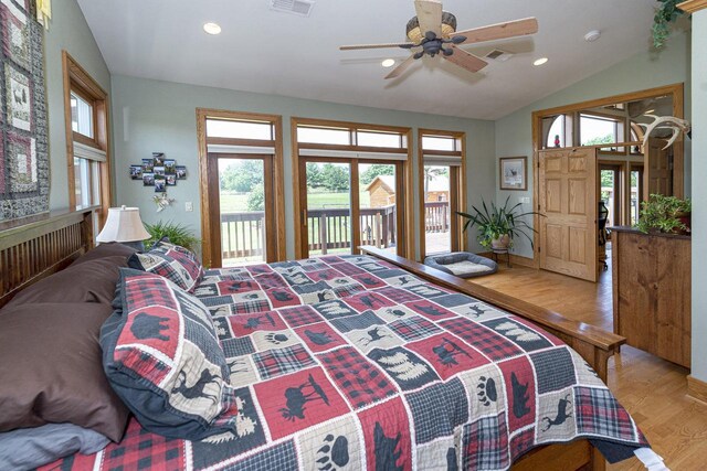 W340S2401 County Road C, Oconomowoc, WI 53066 - bedroom with access to outside, visible vents, vaulted ceiling, and wood finished floors