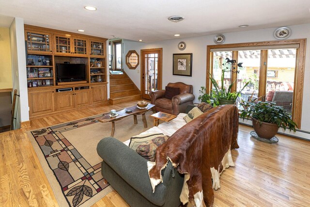 W340S2401 County Road C, Oconomowoc, WI 53066 - living room with light wood finished floors, stairs, visible vents, and recessed lighting