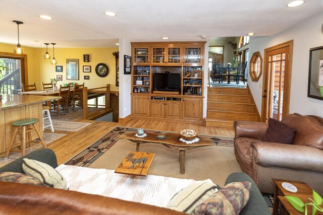 W340S2401 County Road C, Oconomowoc, WI 53066 - living area featuring light wood-style flooring, stairs, and recessed lighting