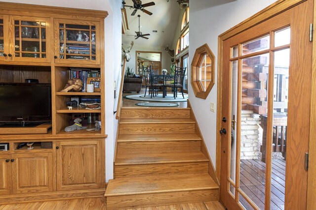 W340S2401 County Road C, Oconomowoc, WI 53066 - stairway featuring wood finished floors, ceiling fan, baseboards, and a wealth of natural light
