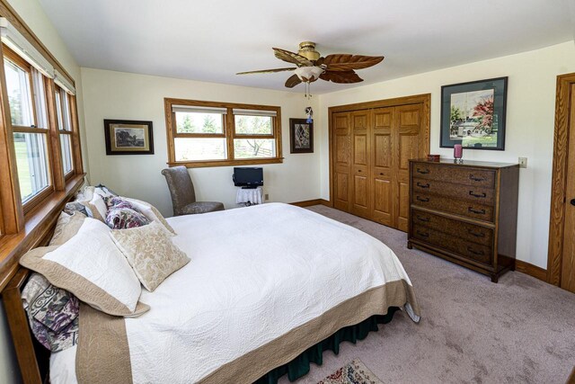 W340S2401 County Road C, Oconomowoc, WI 53066 - bedroom with a closet, baseboards, ceiling fan, and carpet floors