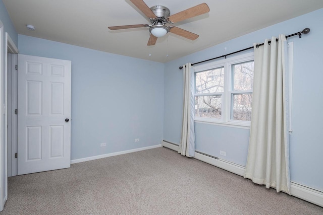 carpeted empty room featuring baseboards, a ceiling fan, and baseboard heating