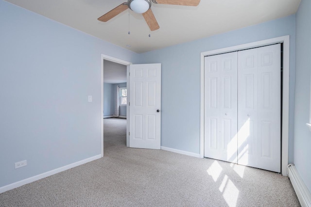 unfurnished bedroom featuring baseboards, carpet, and baseboard heating
