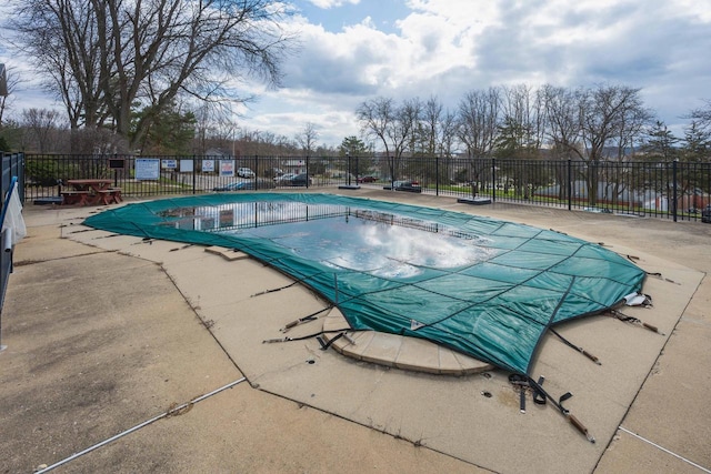 pool featuring a patio area and fence