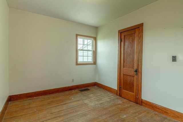 N1616 Haddinger Rd, Monroe, WI 53566 - spare room with baseboards and light wood-type flooring