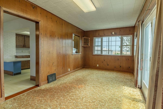 N1616 Haddinger Rd, Monroe, WI 53566 - spare room featuring wooden walls