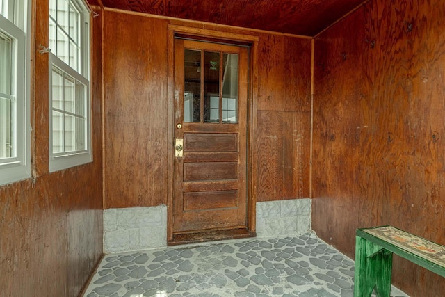 N1616 Haddinger Rd, Monroe, WI 53566 - stairs with wooden walls, healthy amount of natural light, stone flooring, and wood ceiling