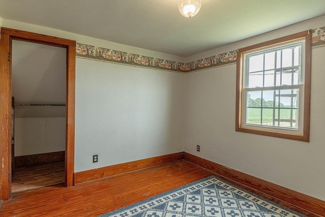 N1616 Haddinger Rd, Monroe, WI 53566 - spare room with wood finished floors and baseboards