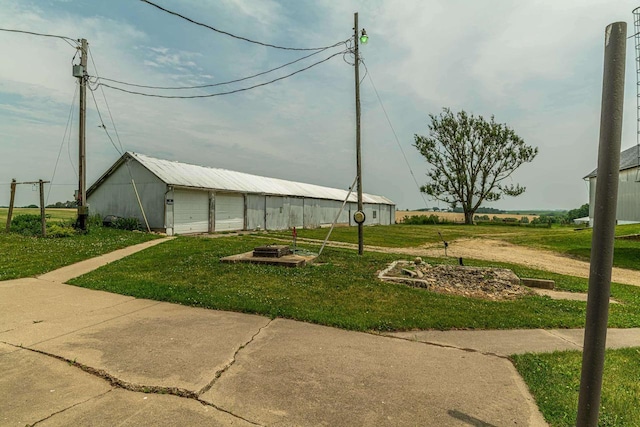 N1616 Haddinger Rd, Monroe, WI 53566 - view of community featuring an outdoor structure, a yard, an outbuilding, and a detached garage