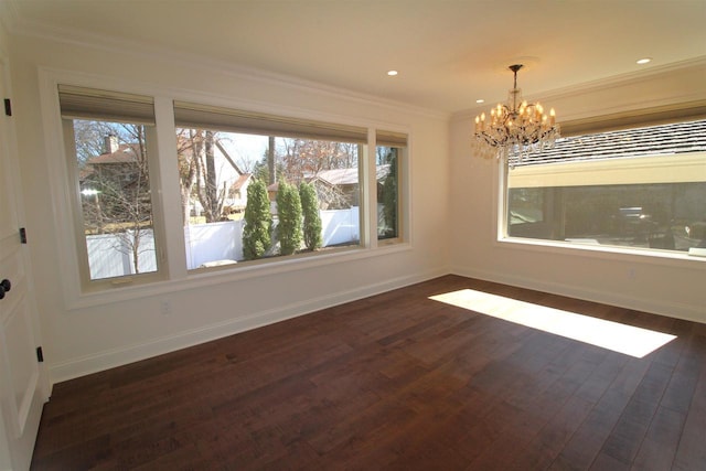 4786 Cardinal Ln, Sun Prairie, WI 53590 - unfurnished dining area with baseboards, a healthy amount of sunlight, a chandelier, and dark wood-style flooring