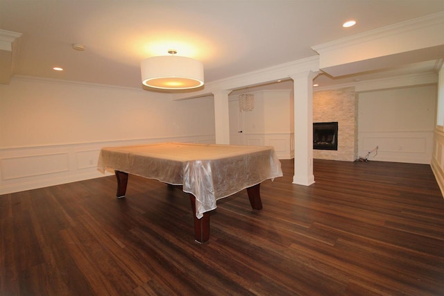 4786 Cardinal Ln, Sun Prairie, WI 53590 - rec room with a decorative wall, ornamental molding, a wainscoted wall, and dark wood-style flooring