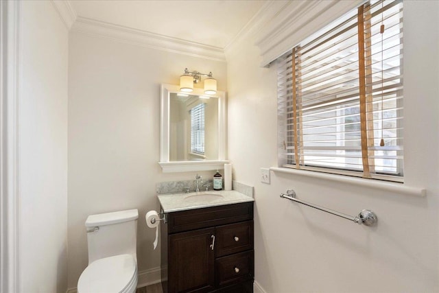 4786 Cardinal Ln, Sun Prairie, WI 53590 - half bathroom with baseboards, toilet, vanity, and ornamental molding