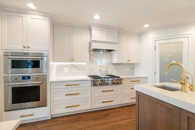 4786 Cardinal Ln, Sun Prairie, WI 53590 - kitchen featuring light countertops, a sink, white cabinetry, and appliances with stainless steel finishes