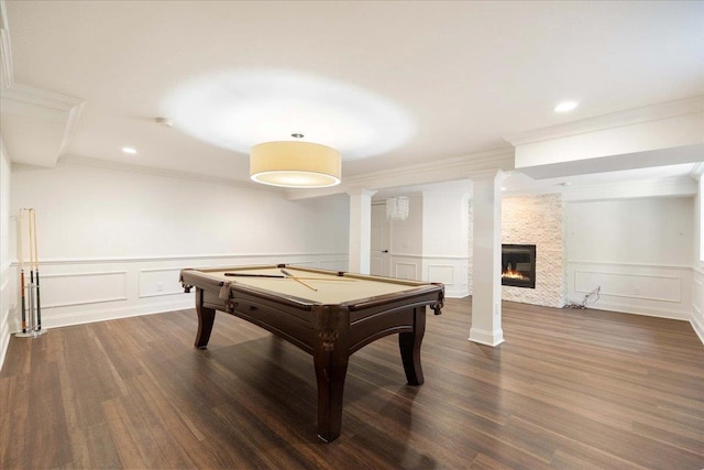 4786 Cardinal Ln, Sun Prairie, WI 53590 - rec room featuring dark wood finished floors, billiards, ornamental molding, a decorative wall, and a large fireplace