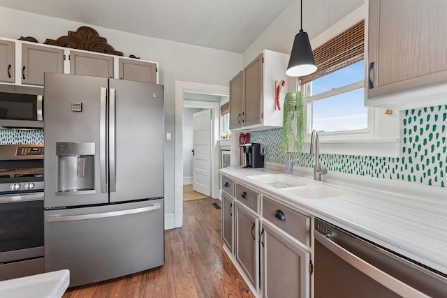 E3625 Wilkinson Rd, La Valle, WI 53941 - kitchen with tasteful backsplash, a sink, light countertops, appliances with stainless steel finishes, and dark wood finished floors