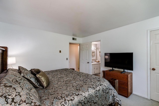3410 Valley Ridge Rd Unit 1, Middleton, WI 53562 - bedroom with light colored carpet and ensuite bath
