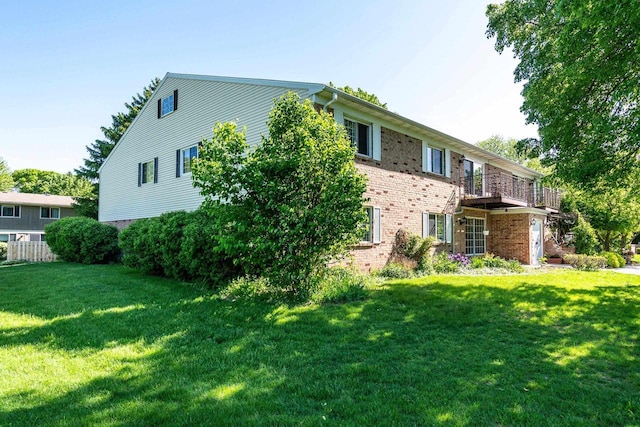 3410 Valley Ridge Rd Unit 1, Middleton, WI 53562 - rear view of property with brick siding and a lawn