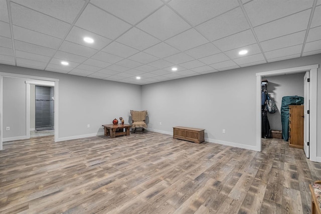 W7181 Duck Creek Ave, Westfield, WI 53964 - living area featuring recessed lighting, baseboards, a drop ceiling, and wood finished floors
