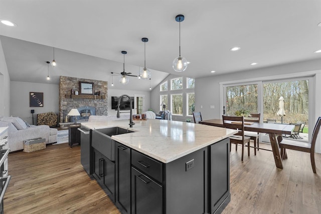 W7181 Duck Creek Ave, Westfield, WI 53964 - kitchen featuring a ceiling fan, open floor plan, vaulted ceiling, and a sink