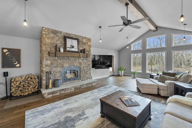 W7181 Duck Creek Ave, Westfield, WI 53964 - living room with a ceiling fan, a fireplace, wood finished floors, baseboards, and beamed ceiling