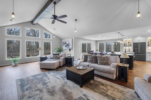 W7181 Duck Creek Ave, Westfield, WI 53964 - living area featuring a ceiling fan, high vaulted ceiling, beamed ceiling, wood-type flooring, and recessed lighting