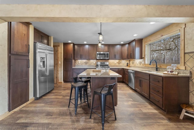 W7181 Duck Creek Ave, Westfield, WI 53964 - kitchen with a center island, a sink, dark wood-style flooring, and appliances with stainless steel finishes