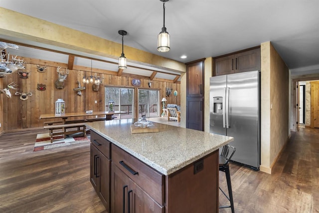 W7181 Duck Creek Ave, Westfield, WI 53964 - kitchen featuring wood walls, dark wood-style flooring, decorative light fixtures, and stainless steel fridge with ice dispenser