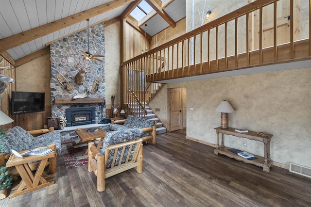 W7181 Duck Creek Ave, Westfield, WI 53964 - living area featuring a skylight, stairs, wood finished floors, beamed ceiling, and visible vents